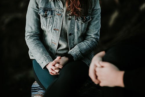 Two young women talking to each other