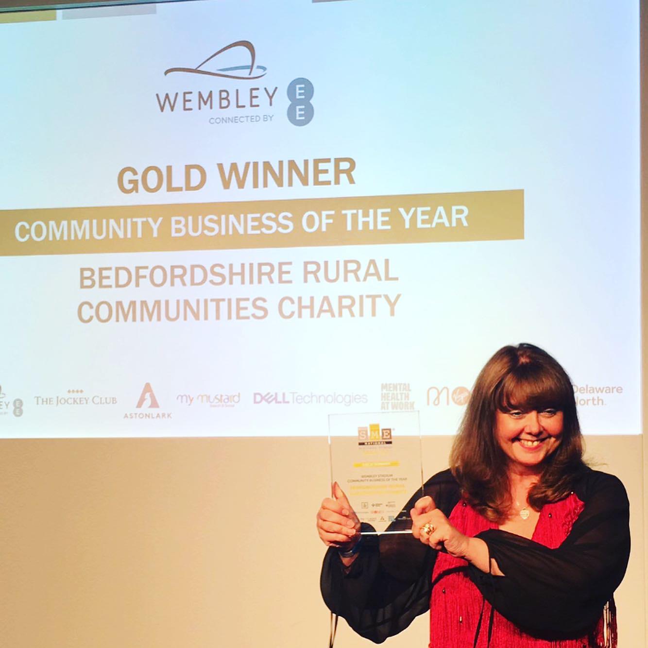 Tracy Cowan BRCC CEO holding Community Business of the Year trophy