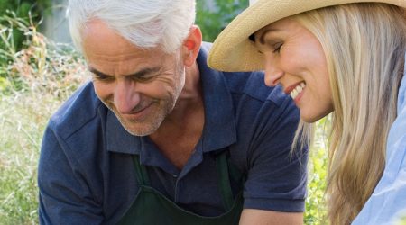 Middle aged man and woman gardening