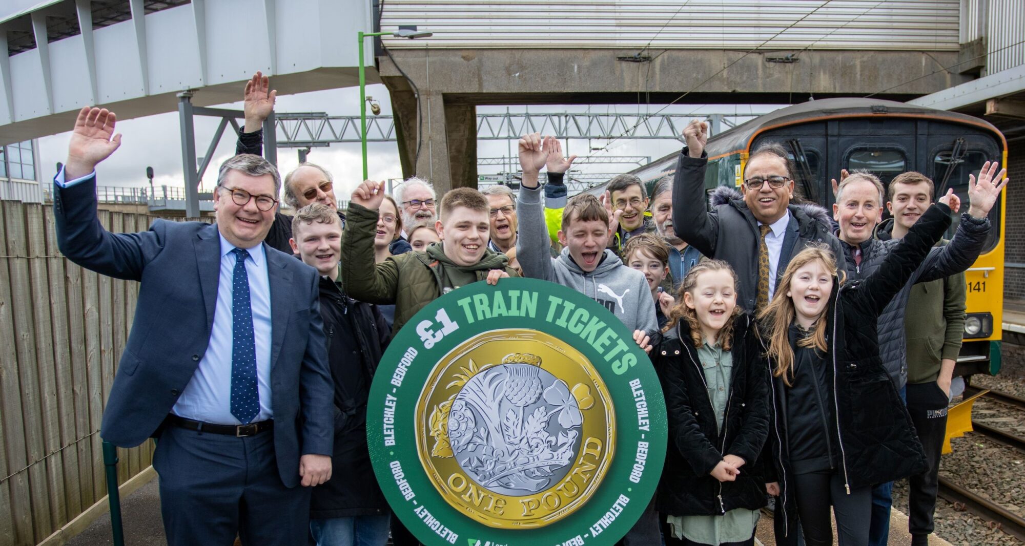 Iain Stewart & Mohammad Yasin Mp With Passengers On Platform Cropped