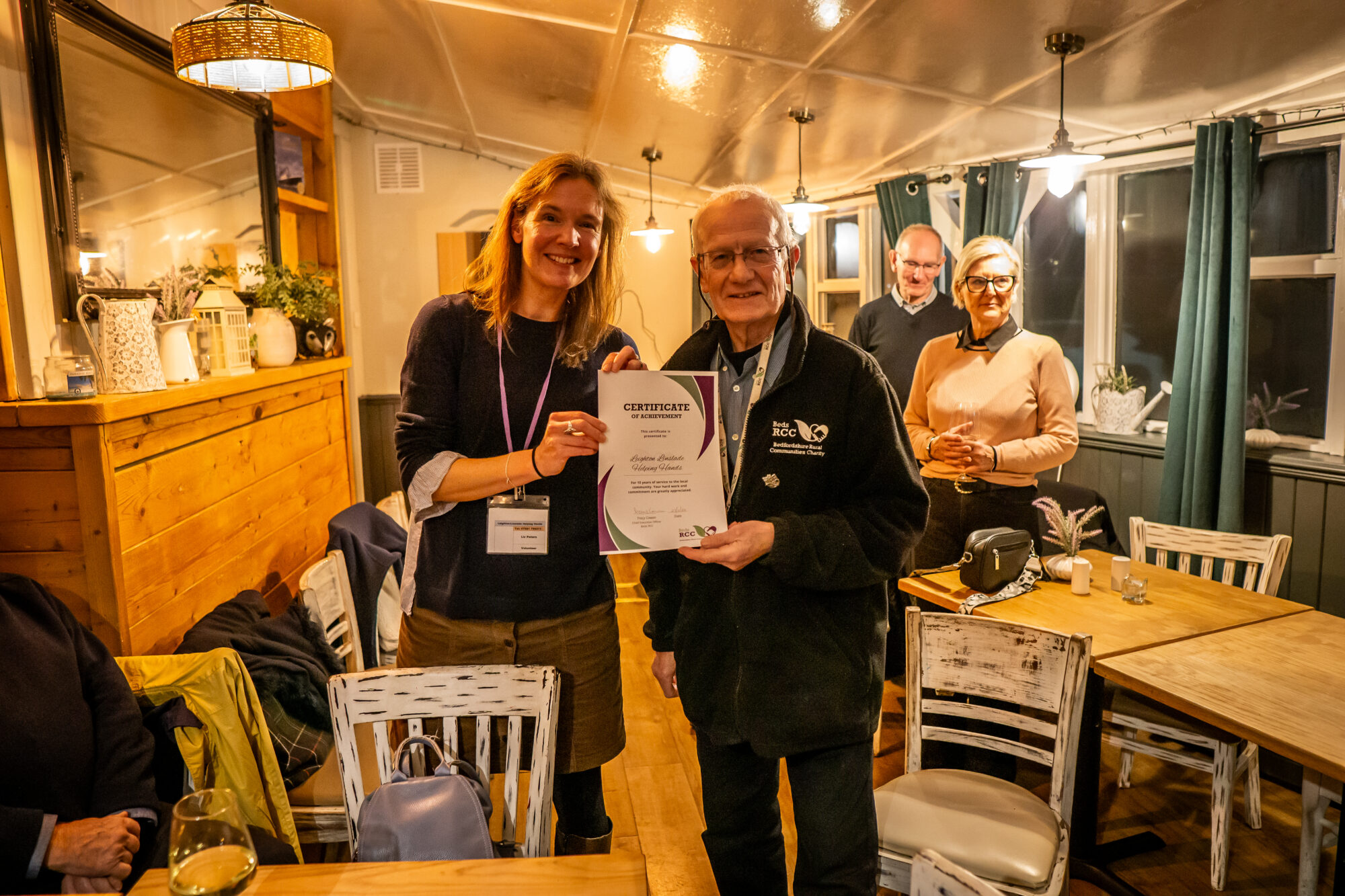 Simon Patterson giving the certificate to Liz of Leighton Linslade Helping Hands.